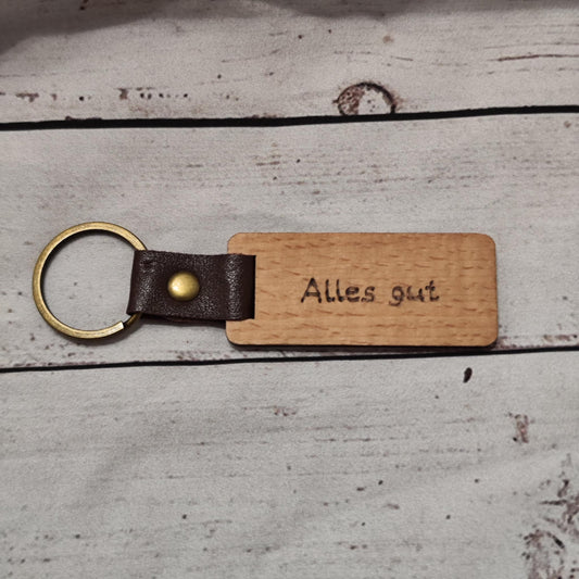 Schlüsselanhänger aus Holz mit Brandmalerei – personalisierbar